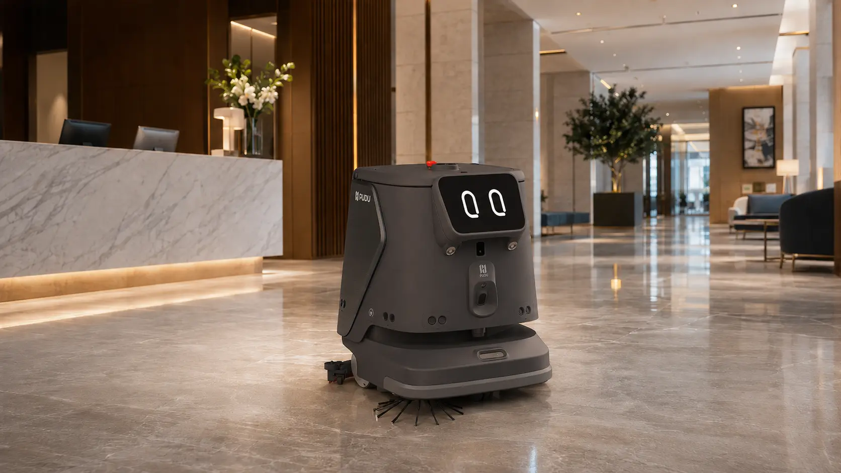 PUDU CC1 autonomous commercial cleaning robot operating in a hotel lobby