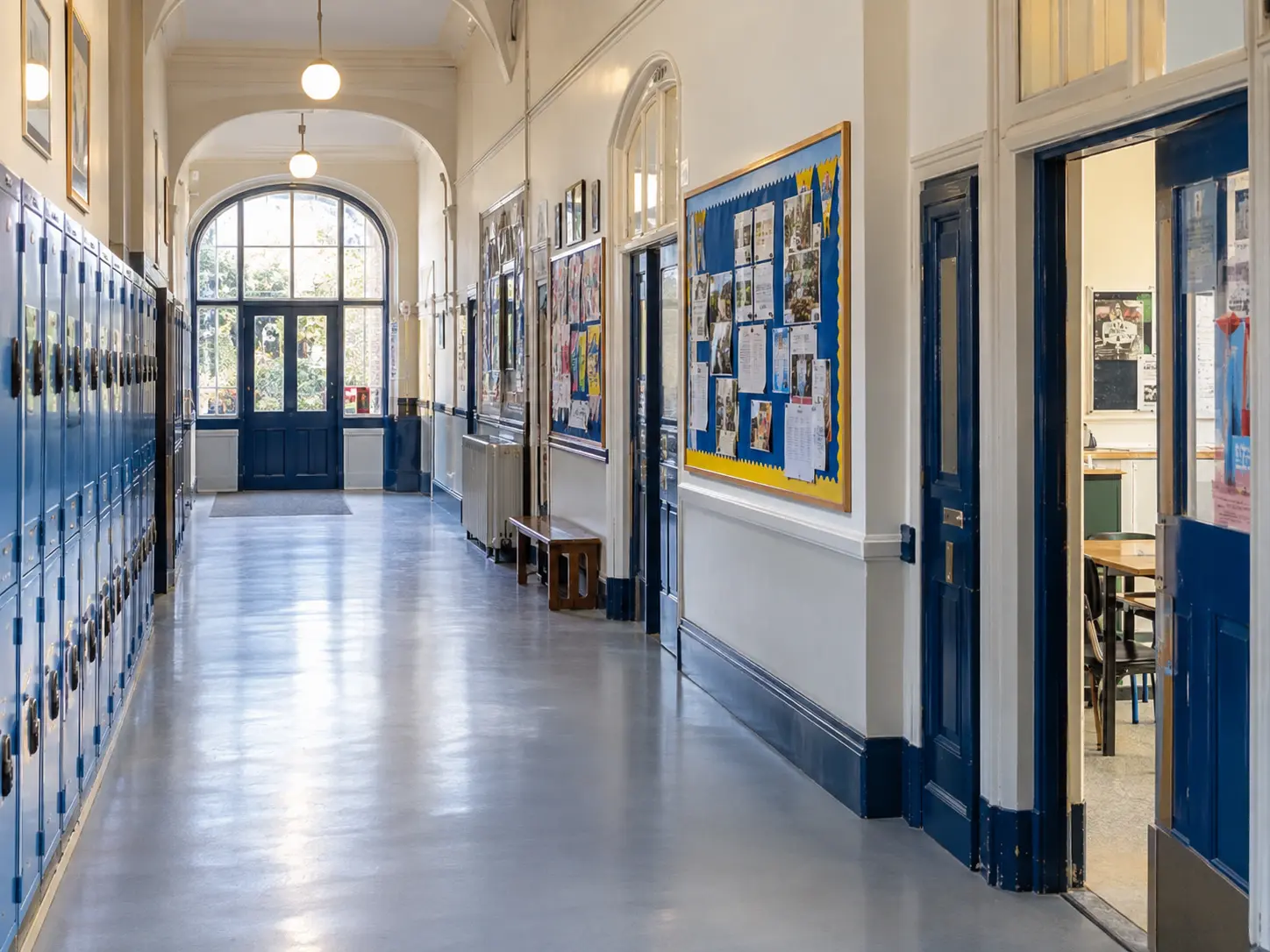 PUDU cleaning machines in a school corridor